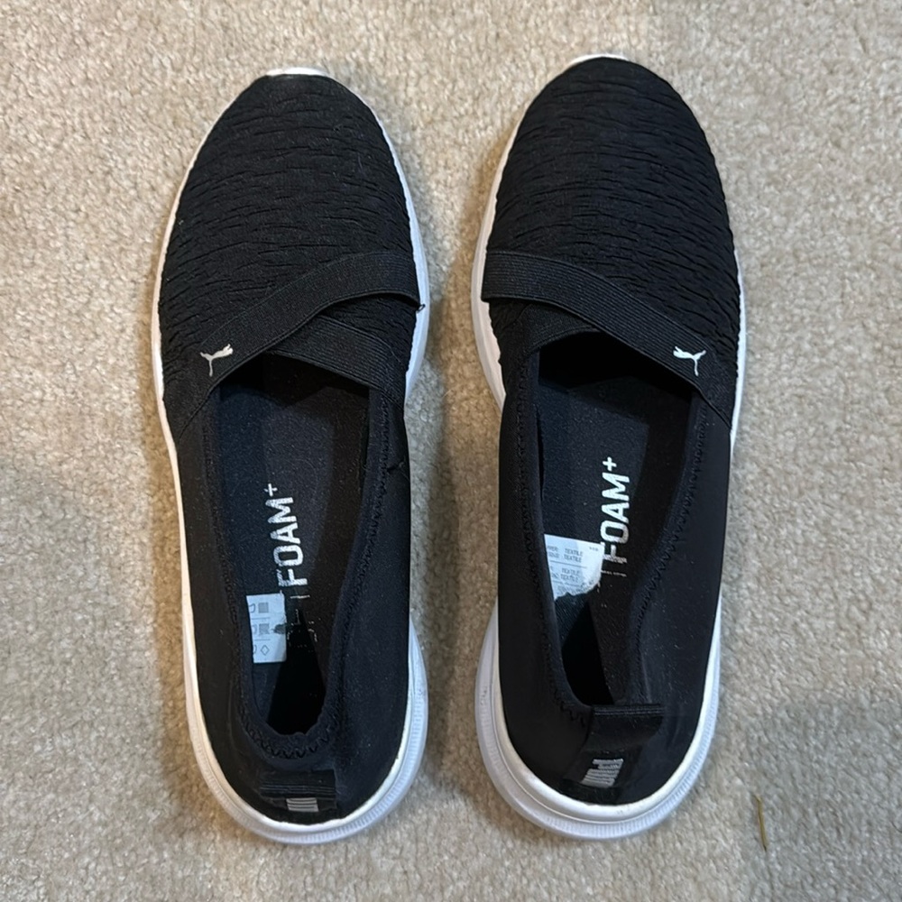 Puma black slip on sneakers